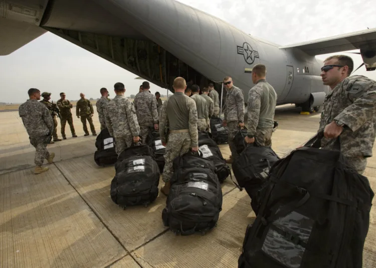 U.S. Army Soldiers with Combined Joint Task Force-Horn of Africa's East Africa Response Force (EARF), load onto a U.S. Air Force C-130J Hercules to redeploy to Djibouti after being relieved by other members of their team in Juba, South Sudan, Jan. 22, 2014. The EARF has been positioned at the U.S. Embassy in Juba, South Sudan since Dec. 18, 2013, when the initial evacuation of U.S. citizens took place. The EARF is part of a Defense Department initiative of regionally aligned forces, which provides the commander of the U.S. Africa Command an additional capability to respond to crises and contingencies within East Africa. (U.S. Air Force photo by Staff Sgt. Staci Miller/RELEASED)