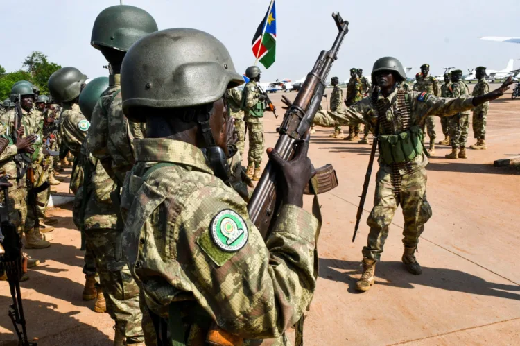 Members of South Sudan People's Defence Forces (SSPDF), part of the troops of the East Africa Community Regional Force (EACRF), sing before departing on their deployment as part of a regional military operation targeting rebels, at the Juba International Airport in Juba, South Sudan April 3, 2023. REUTERS/Samir Bol