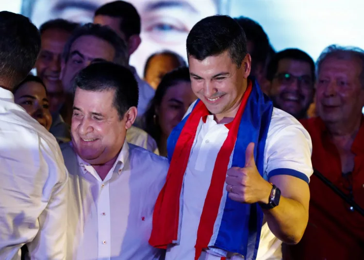 Paraguayan presidential candidate Santiago Pena from the ruling Colorado Party reacts at the party headquarters as he and his running mate Pedro Alliana won Paraguay's presidential race, according to the preliminary official count, in Asuncion, Paraguay April 30, 2023. REUTERS/Agustin Marcarian