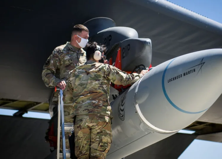 Master Sgt. John Malloy and Staff Sgt. Jacob Puente, both from 912th Aircraft Maintenance Squadron, secure the AGM-183A Air-launched Rapid Response Weapon Instrumented Measurement Vehicle 2 (ARRW IMV-2) as it is loaded under the wing of a B-52H Stratofortress at Edwards Air Force Base, California, U.S., August 6, 2020. Picture taken August 6, 2020. U.S. Air Force/Giancarlo Casem/Handout via REUTERS ATTENTION EDITORS - THIS IMAGE HAS BEEN SUPPLIED BY A THIRD PARTY. To match Special Report USA-CHINA/BOMBERS