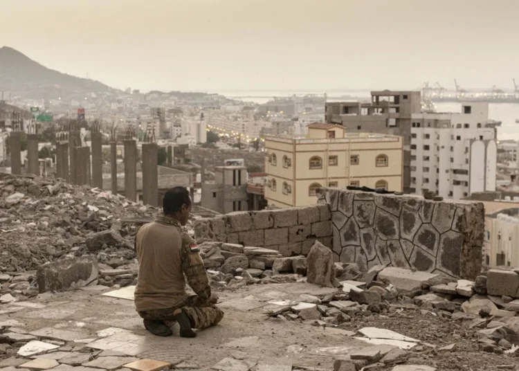 ADEN, YEMEN - FEBRUARY 22: A Southern Transitional Council soldier performs the evening prayer overlooking the city of Aden, Yemen, on 22 February 2022. MANDATORY CREDIT: (Photo by Sam Tarling/Sana'a Center for Strategic Studies)