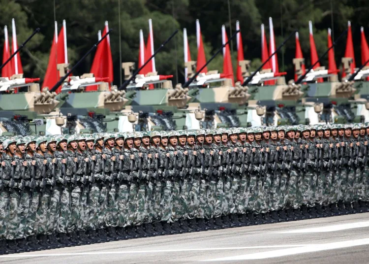 Soldiers react as Chinese President Xi Jinping (unseen) inspects troops at the People's Liberation Army (PLA) Hong Kong Garrison as part of events marking the 20th anniversary of the city's handover from British to Chinese rule, in Hong Kong, China June 30, 2017. REUTERS/Damir Sagolj