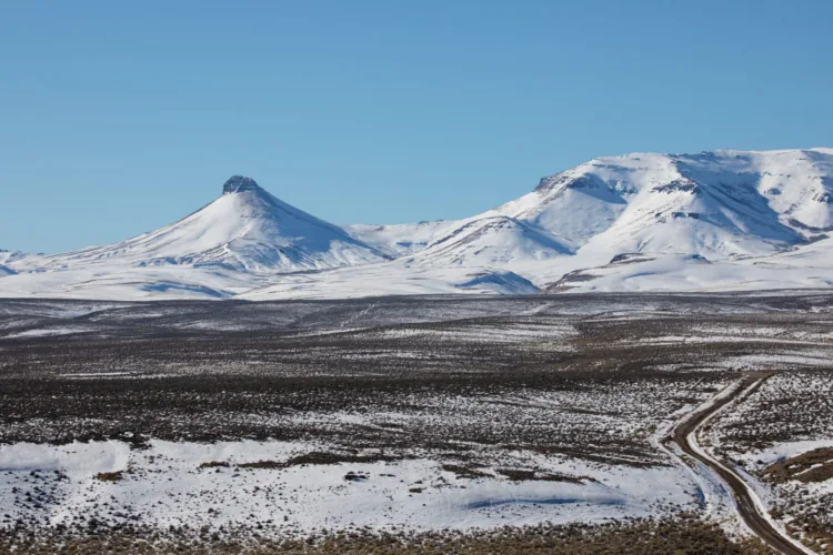Disaster Peak, left, punctuates the northwest rim of the McDermitt Caldera in southeast Oregon in this Jan. 14, 2022, photo. The historic lakebed in the foreground contains some of the highest concentrations of lithium in the United States.