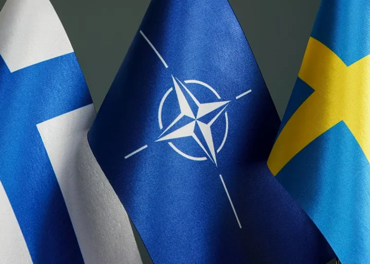 KYIV, UKRAINE - May 7, 2022. Flags of Sweden, Finland and NATO.