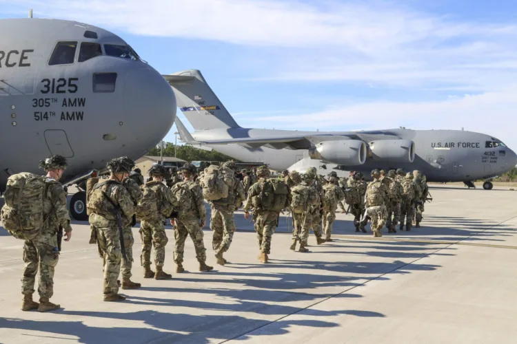 U.S. Army Paratroopers assigned to the 2nd Battalion, 504th Parachute Infantry Regiment, 1st Brigade Combat Team, 82nd Airborne Division, deploy from Pope Army Airfield, N.C., on  Jan. 1, 2020.