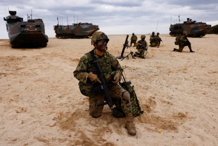 Japanese Ground Self-Defense Force's Amphibious Rapid Deployment Brigade (ARDB) soldiers take part in a marine landing drill as a part of the country's nationwide 05JX military exercises at Tokunoshima island, Kagoshima prefecture, southwestern Japan, November 19, 2023.  REUTERS/Issei Kato