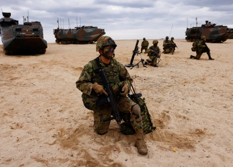 Japanese Ground Self-Defense Force's Amphibious Rapid Deployment Brigade (ARDB) soldiers take part in a marine landing drill as a part of the country's nationwide 05JX military exercises at Tokunoshima island, Kagoshima prefecture, southwestern Japan, November 19, 2023.  REUTERS/Issei Kato