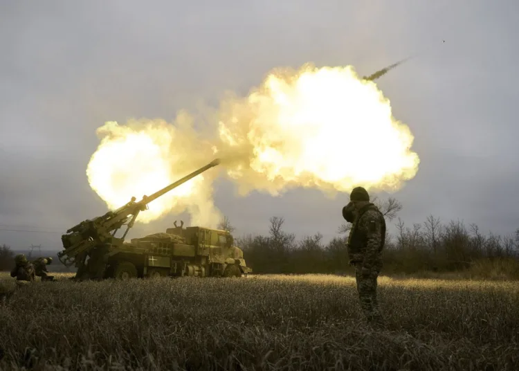 Ukrainian soldiers fire a French-made CAESAR self-propelled howitzer towards Russian positions near Avdiivka, Donetsk region, Ukraine, Monday, Dec. 26, 2022. (AP Photo/Libkos)