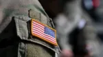 A US flag is pictured on a soldier's uniform at the United States Army military training base in Grafenwoehr, southern Germany, on March 11, 2022. (Photo by Christof STACHE / AFP) (Photo by CHRISTOF STACHE/AFP via Getty Images)