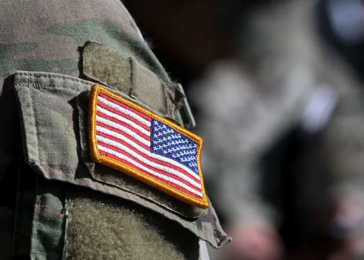 A US flag is pictured on a soldier's uniform at the United States Army military training base in Grafenwoehr, southern Germany, on March 11, 2022. (Photo by Christof STACHE / AFP) (Photo by CHRISTOF STACHE/AFP via Getty Images)
