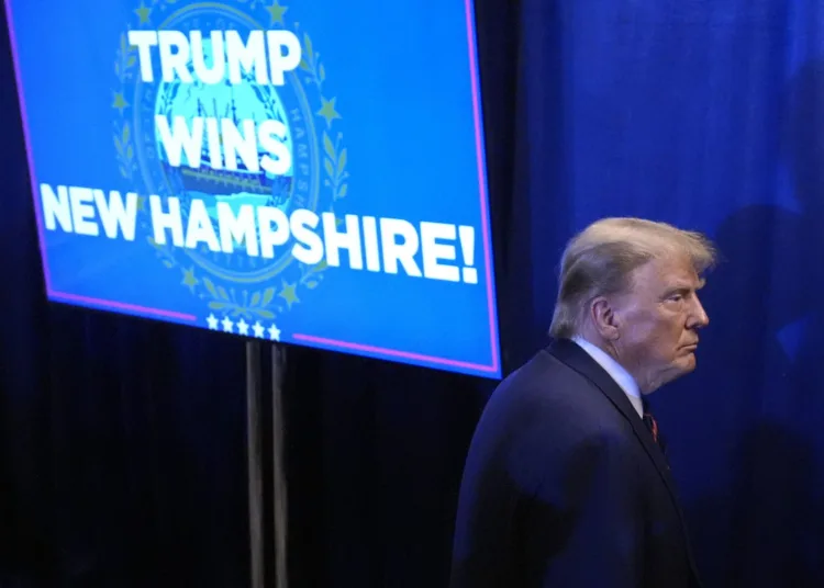 Republican presidential candidate former President Donald Trump walks backstage after speaking at a primary election night party in Nashua, N.H., Tuesday, Jan. 23, 2024. (AP Photo/Matt Rourke)