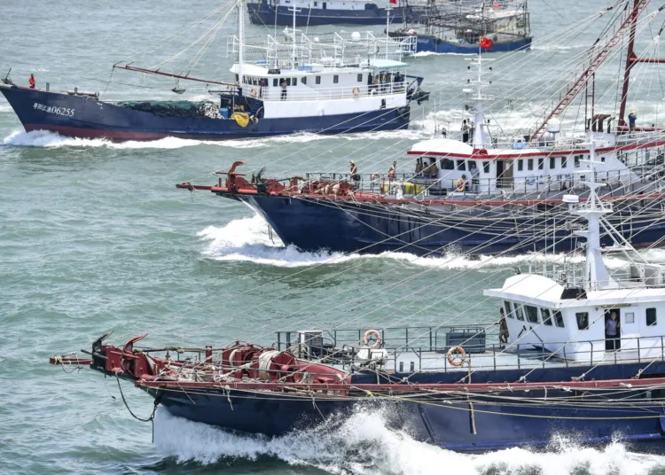 Hundreds of fishing boats leave for fishing as fishing ban in South China Sea ends in Yangjiang city, south Chinas Guangdong province, 16 August 2019. (Photo by Chen Jimin / Imaginechina / Imaginechina via AFP)