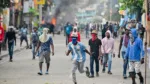 People demonstrate calling for the departure of Haitian Prime Minister Ariel Henry in Port-au-Prince on February 7, 2024. (Photo by Richard PIERRIN / AFP)