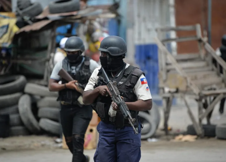 Police officers patrol a neighborhood amid gang-related violence in downtown Port-au-Prince on April 25, 2023. Between April 14 and 19, clashes between rival gangs left nearly 70 people dead, including 18 women and at least two children, according to a United Nations statement released April 24. (Photo by