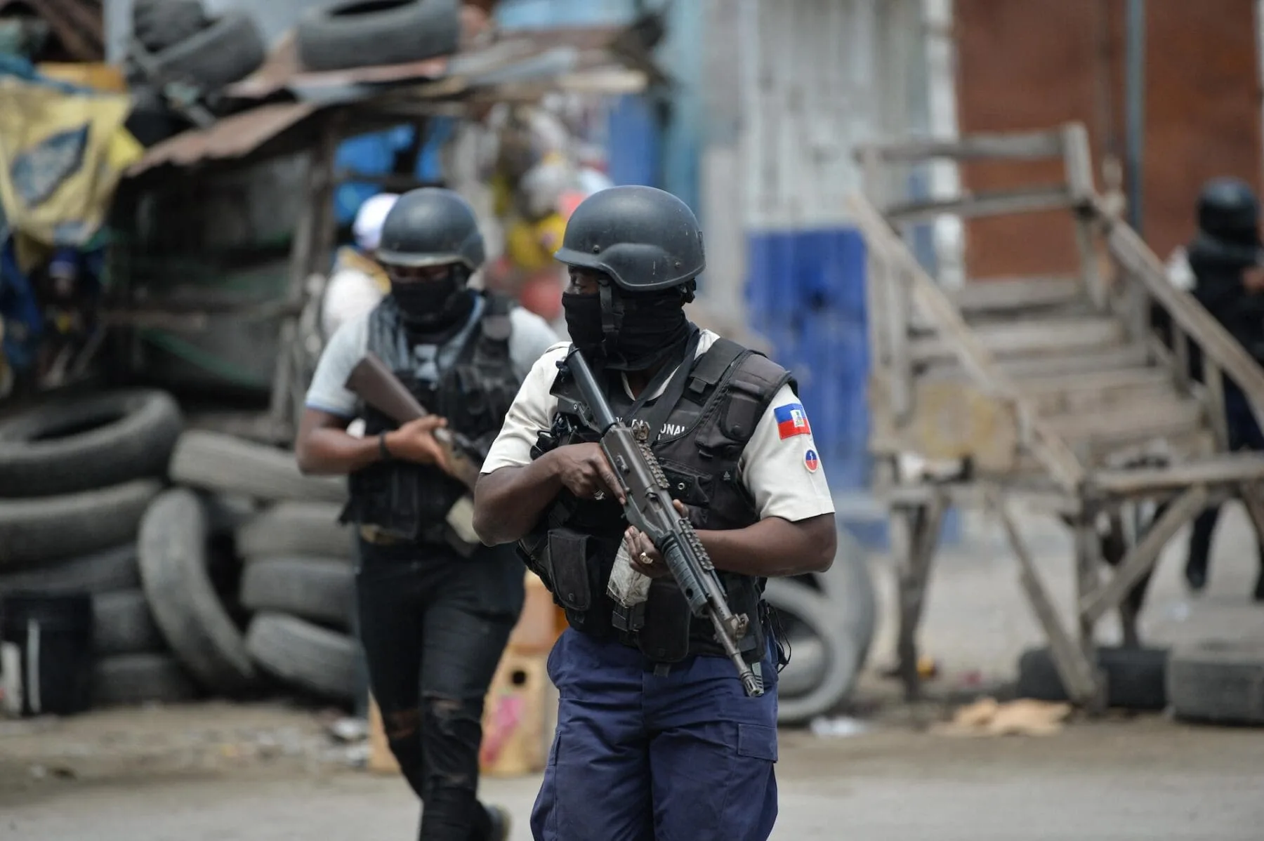 Police officers patrol a neighborhood amid gang-related violence in downtown Port-au-Prince on April 25, 2023. Between April 14 and 19, clashes between rival gangs left nearly 70 people dead, including 18 women and at least two children, according to a United Nations statement released April 24. (Photo by