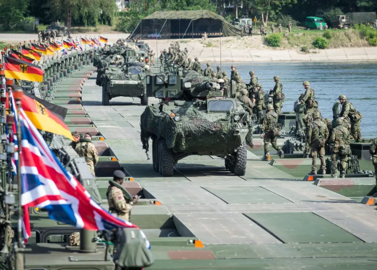 Across Poland more than 30,000 soldiers from 24 participating nations have deployed on
Exercise Anakonda 2016 a Polish led joint multinational exercise. Included in this number
and based in the Chelmno area are Sappers from 23 Amphibious Engineer Troop (23
Amph Engr Tp), Royal Engineers and their Bundeswehr colleagues from Pionierbattalion
130 with whom they are co-located with in Minden, Germany.

With Exercise Anakonda having the primary aim of testing the readiness and interoperability of the Polish forces and its NATO allies 23 Amp Tp and Pionierbattalion 130 have supported these assurance requirements by demonstrating the unique capabilities of their M3 Amphibious Rig to enable the US Army’s 2 Cavalry Regiment to quickly cross the River Vistula.

This was achieved first by joining several M3 rigs together to ferry the reconnaissance element across the river followed 45 minutes later by an impressive display that saw 30 rigs come together to form a bridge over 300m long that allowed the remainder of the 2 Cavalry Regiment to pass over the water obstacle.

With the crossing complete the adaptability and benefits of the two Units collaboration and
integration combined with their rigorous training regime was clear for all to see.

Photographer; Mr Dominic King 
Army Press Office Germany
Description Writer; Mr David Allen
Press Officer APOG