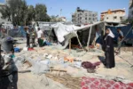 Palestinians inspect the damage following an Israeli strike at a tent camp in Al-Mawasi area, amid Israel-Hamas conflict, in Khan Younis in the southern Gaza Strip July 13, 2024. REUTERS/Hatem Khaled