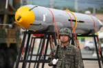 A South Korean soldier stands in front of a missile displayed during a media day for the 71st anniversary of Armed Forces Day at Daegu Air Base in Daegu, South Korea, on Friday, Sept. 27, 2019. South Korea announced last month it would withdraw from a military information-sharing agreement with Japan in November, prompting U.S. Assistant Secretary of Defense Randall Schriver to warn Seoul that its decision threatened U.S. security interests. Photographer: SeongJoon Cho/Bloomberg