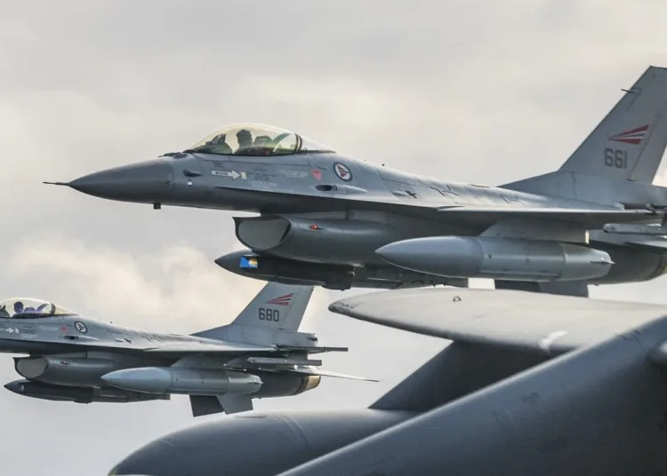 Royal Norwegian Air Force F-16 Fighting Falcons assigned to the 331st Squadron, Bodø Air Force Base, Norway, fly next to the wing of a U.S. Air Force 2nd Bomb Wing B-52H Stratofortress during training and integration with the Norwegian Air Force in support of Bomber Task Force Europe 20-1, Oct. 30, 2019, in Norwegian airspace. This deployment allows aircrews and support personnel to conduct theater integration and to improve bomber interoperability with joint partners and allied nations. (U.S. Air Force photo by Tech. Sgt. Christopher Ruano)