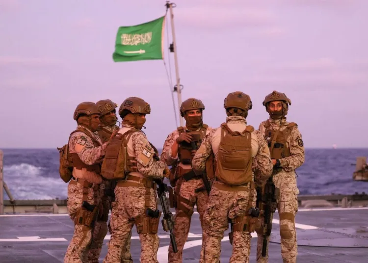 Saudi security officers stand guard onboard a Saudi vessel docked off the seaport of Port Sudan on April 30, 2023, during evacuations efforts from Sudan. - Heavy fighting again rocked Sudan's capital as tens of thousands have fled the bloody turmoil and a former prime minister warned of the "nightmare" risk of a descent into full-scale civil war. Foreign nations have scrambled to evacuate thousands of their citizens by air, road and sea since the fighting plunged the poverty-stricken country into deadly turmoil on April 15. (Photo by Fayez Nureldine / AFP) (Photo by FAYEZ NURELDINE/AFP via Getty Images)