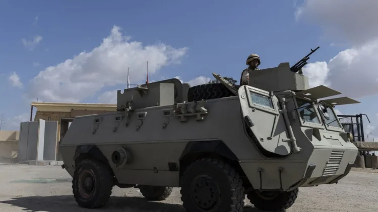 NORTH SINAI, EGYPT - OCTOBER 19: A military vehicle is seen at the Rafah border crossing to Gaza on October 19, 2023 in North Sinai, Egypt. The aid convoy, organized by a group of Egyptian NGOs, set off Saturday 14th October from Cairo for the Gaza-Egypt border crossing at Rafah. On October 7th, the Palestinian militant group Hamas launched a surprise attack on border communities in southern Israel, spurring the most violent flare-up of the Israel-Palestine conflict in decades. Israel launched a vast bombing campaign in retaliation and has warned of an imminent ground invasion. (Photo by Mahmoud Khaled/Getty Images)