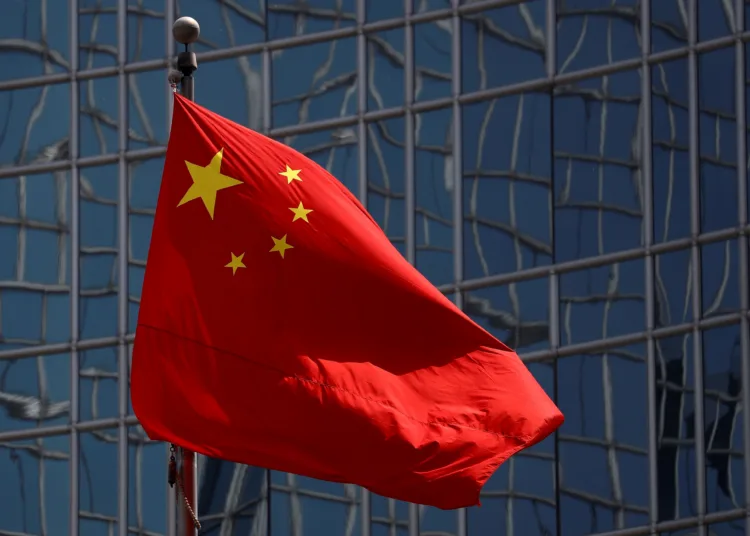 FILE PHOTO: The Chinese national flag is seen in Beijing, China April 29, 2020. REUTERS/Thomas Peter/File Photo/File Photo