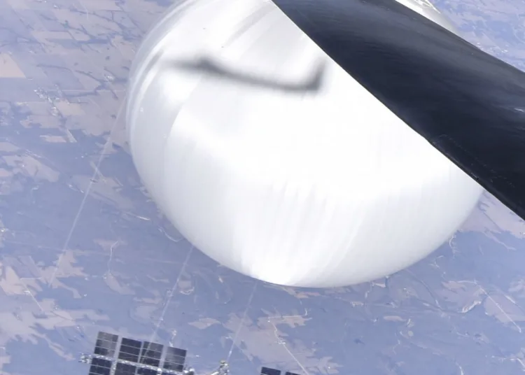 A U.S. Air Force pilot looked down at the suspected Chinese surveillance balloon as it hovered over the Central Continental United States February 3, 2023. Recovery efforts began shortly after the balloon was downed. (Photo courtesy of the Department of Defense)