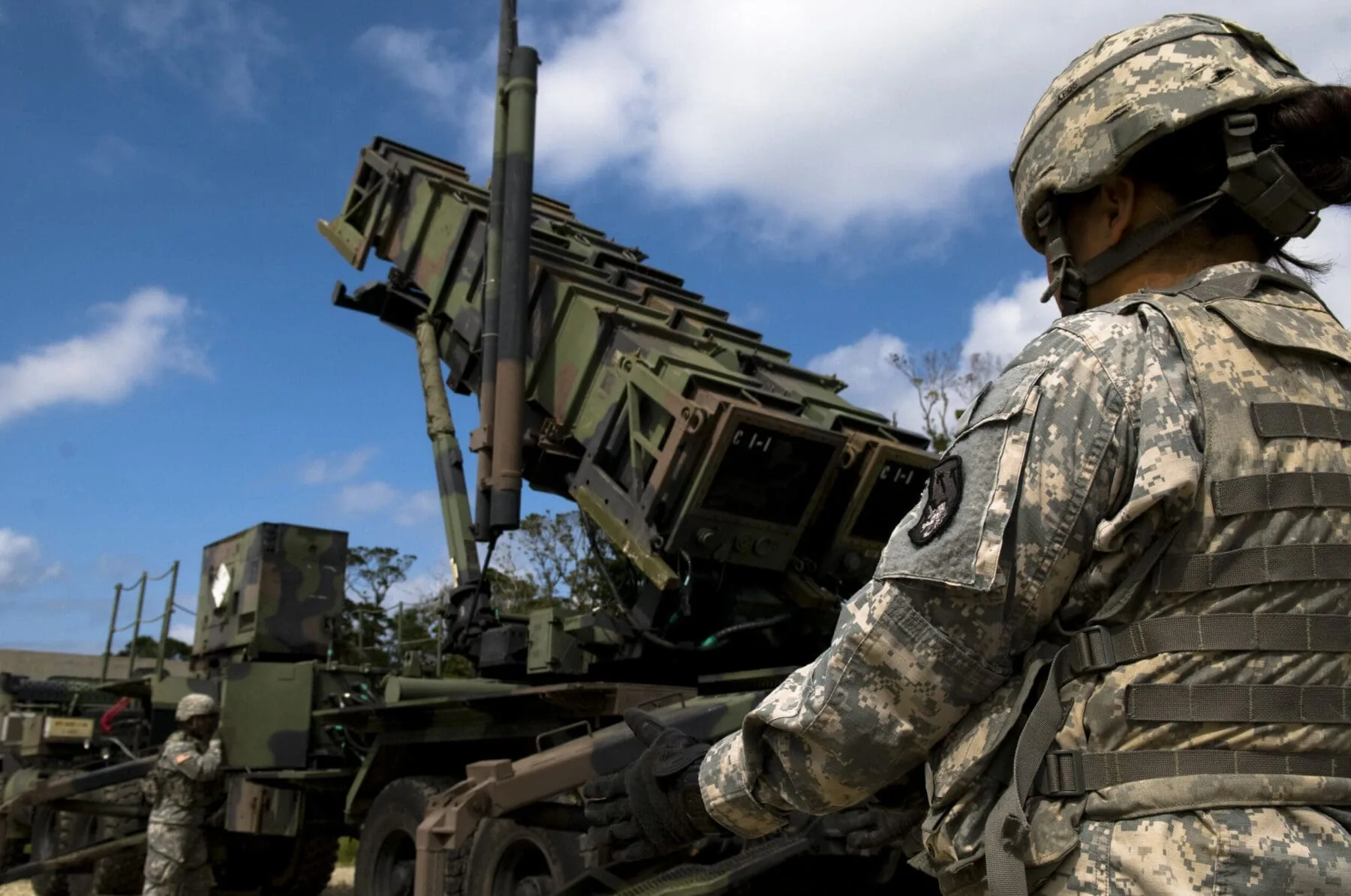 U.S. Army Privates 1st Class Danica Sasakura and Dean Werner, 1-1 Air Defense Artillery, Charley Battery Patriot Missile operators, perform pre-launch checks on a Patriot missile launcher as part of a field training exercise on Kadena Air Base, Japan, Oct. 26. Kadena hosts the largest combat wing in the Pacific and includes U.S. Air Force, Army, Navy and Marine Corps assets.