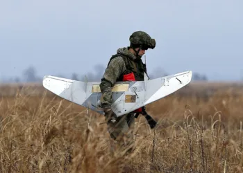 A Russian soldier holds a drone during the joint Russian, Belarusian and Serbian military exercise "The Slavic Brotherhood 2016", at military airport Kovin, 40 kilometers east of Belgrade, Serbia, Monday, Nov. 7, 2016. The 13-day armed exercise in Serbia, dubbed "The Slavic Brotherhood 2016" include 150 Russian paratroopers, 50 air force staffers, 3 transport planes and an unspecified number of troops from Serbia and Belarus, Russia's Defense Ministry said. (AP Photo/Darko Vojinovic)
