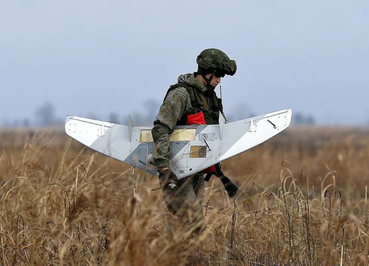 A Russian soldier holds a drone during the joint Russian, Belarusian and Serbian military exercise "The Slavic Brotherhood 2016", at military airport Kovin, 40 kilometers east of Belgrade, Serbia, Monday, Nov. 7, 2016. The 13-day armed exercise in Serbia, dubbed "The Slavic Brotherhood 2016" include 150 Russian paratroopers, 50 air force staffers, 3 transport planes and an unspecified number of troops from Serbia and Belarus, Russia's Defense Ministry said. (AP Photo/Darko Vojinovic)