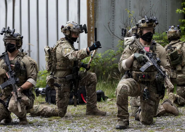 U.S. Army Green berets assigned to the 1st Battalion, 10th Special Forces Group await the order to commence a building breach, as part of Close Quarter Battle (CQB) training, May 5, 2020. Local missions are designed to maintain proficiency.  (U.S. Army photo by Staff Sgt. Thomas Mort)