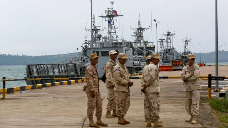 Sailors stand guard near petrol boats at the Cambodian Ream Naval Base in Sihanoukville, Cambodia, July 26, 2019. REUTERS/Samrang Pring