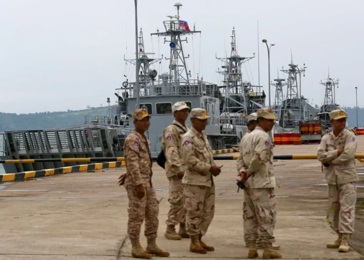 Sailors stand guard near petrol boats at the Cambodian Ream Naval Base in Sihanoukville, Cambodia, July 26, 2019. REUTERS/Samrang Pring