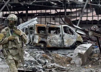 A Russian serviceman patrols the destroyed part of the Ilyich Iron and Steel Works in Ukraine's port city of Mariupol on May 18, 2022, amid the ongoing Russian military action in Ukraine. (Photo by Olga MALTSEVA / AFP) (Photo by OLGA MALTSEVA/AFP via Getty Images)
