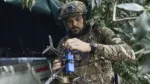 A Ukrainian soldier prepares a drone on the frontline in the Zaporizhzhia region, Ukraine, Saturday, July 1, 2023.