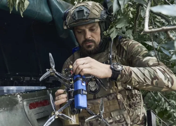 A Ukrainian soldier prepares a drone on the frontline in the Zaporizhzhia region, Ukraine, Saturday, July 1, 2023.