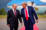 ANCHORAGE, ALASKA - AUGUST 15: (EDITOR'S NOTE: Alternate Crop) U.S. President Donald Trump (R) greets Russian President Vladimir Putin as he arrives at Joint Base Elmendorf-Richardson on August 15, 2025 in Anchorage, Alaska. The two leaders are meeting for peace talks aimed at ending the war in Ukraine. (Photo by Andrew Harnik/Getty Images)