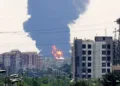 A plume of heavy smoke and fire rise from an oil refinery in southern Tehran, after it was hit in an overnight Israeli strike, on June 15, 2025. Israel pressed its intense bombardment campaign on Iran on June 15, striking a defence facility and fuel depots as the two arch foes kept up their most intense confrontation in history. (Photo by ATTA KENARE / AFP)