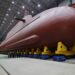 North Korea's leader Kim Jong Un inspected the country's nuclear-powered submarine, claimed to be 8,700 ton, as he called Seoul's nuclear-powered submarine development plan "an offensive act" KCNA